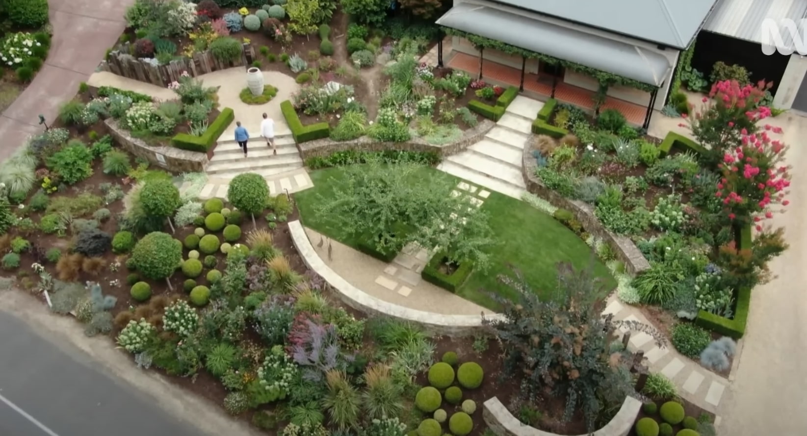 Beautiful landscaped garden with curved pathways and lush greenery